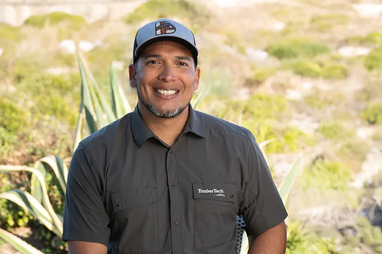 A TimberTech contractor smiles during an interview at a job site in the desert